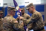 U.S. Army Brig. Gen. Jason Fryman, commander of the Georgia Army National Guard, passes the 78th Troop Command colors to incoming commander U.S. Army Col. Rodney K. Tatum Jr. during the unit’s change of command ceremony at Campbell High School in Smyrna, Georgia, May 2, 2026. The passing of the colors symbolizes the transfer of authority and responsibility from the outgoing commander to the incoming commander. (U.S. Army National Guard photo by Sgt. Cameron Boyd)
