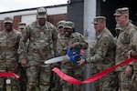 U.S. Army Pfc. Aaliyah Murdock, a supply specialist with the 781st Troop Command Detachment, 78th Troop Command, Georgia Army National Guard, cuts the ceremonial ribbon during the South Cobb Readiness Center ribbon cutting ceremony Mar. 27, 2026, in Marietta, Georgia. With the dedication of the South Cobb Readiness Center, the facility became the headquarters of 78th Troop Command and the 781st Troop Command Detachment. (U.S. Army National Guard photo by Sgt. 1st Class James Braswell)