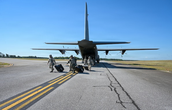 U.S. Air Force aircrew flight equipment specialists, assigned to the 165th Operations Group, 165th Airlift Wing, Georgia Air National Guard, offload equipment from a C-130J Super Hercules aircraft during a readiness exercise at North Auxiliary Field, Joint Base Charleston, South Carolina, May 3, 2026. The exercise mobilized units from across the installation to validate their ability to sustain operations and project combat power in contested environments. (U.S. Air National Guard photo by Senior Airman Christa Ross)