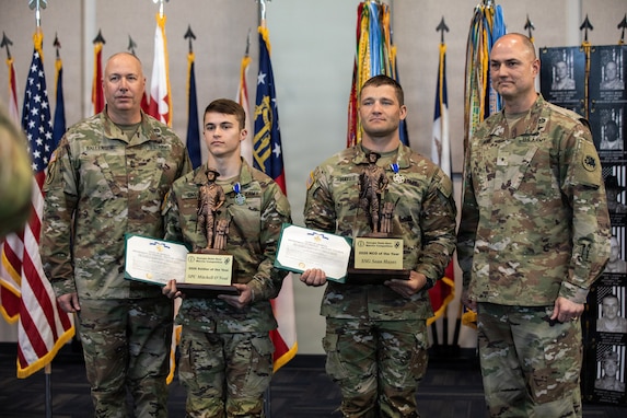U.S. Army Brig. Gen. Jason Fryman, Commander of the Georgia Army National Guard, and Command Sgt. Maj. John Ballenger, senior enlisted leader of the Georgia Army National Guard, stand with U.S. Army Spc. Mitchell Oneal, representing the Macon-based 48th Infantry Brigade Combat Team, Georgia Army National Guard, and U.S. Army Staff Sgt. Sean Hayes, representing the Macon-based 48th Infantry Brigade Combat Team, Georgia Army National Guard, after they received the Soldier of the Year and NCO of the Year awards and the Georgia Meritorious Service Medal during the awards ceremony for the 2026 Georgia Army National Guard State Best Warrior Competition at Clay National Guard Center in Marietta, Georgia, March 13, 2026.The competition demonstrates the readiness and lethality of the Georgia DoD and country of Georgia Defence Force soldiers by testing the competitors with physical fitness assessments, written exams, and other warrior tasks and battle drills. (U.S. Army National Guard photo by Sgt. Jordan McNeal)