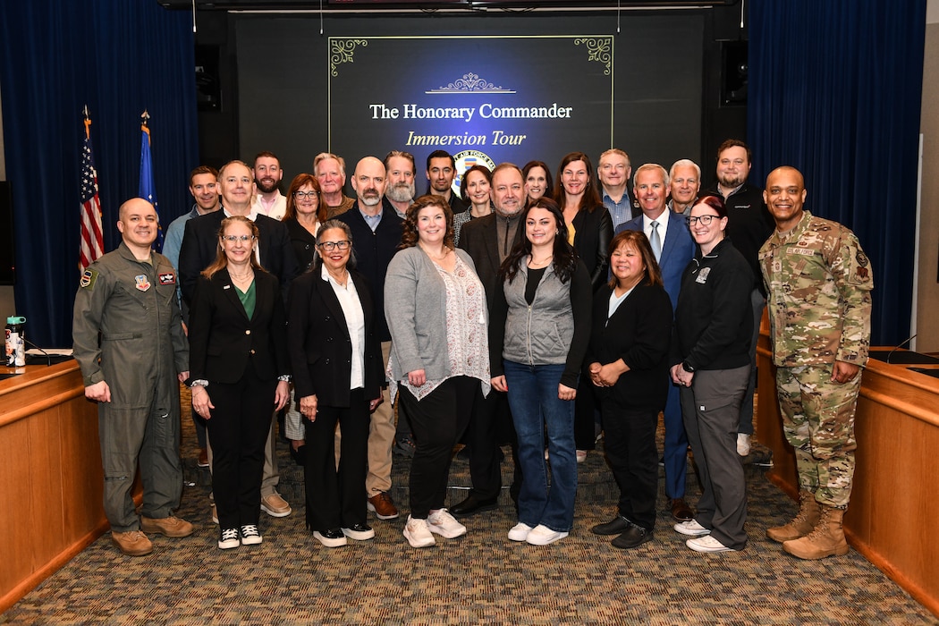 Col. Aaron Gray, 55th Wing commander, and Chief Master Sgt. Andrew Small, 55th Wing command chief, pose for a group photo with Team Offutt's honorary commanders during the honorary commander immersion tour, April 28, 2026.(U.S. Air Force photo by Chad Watkins)