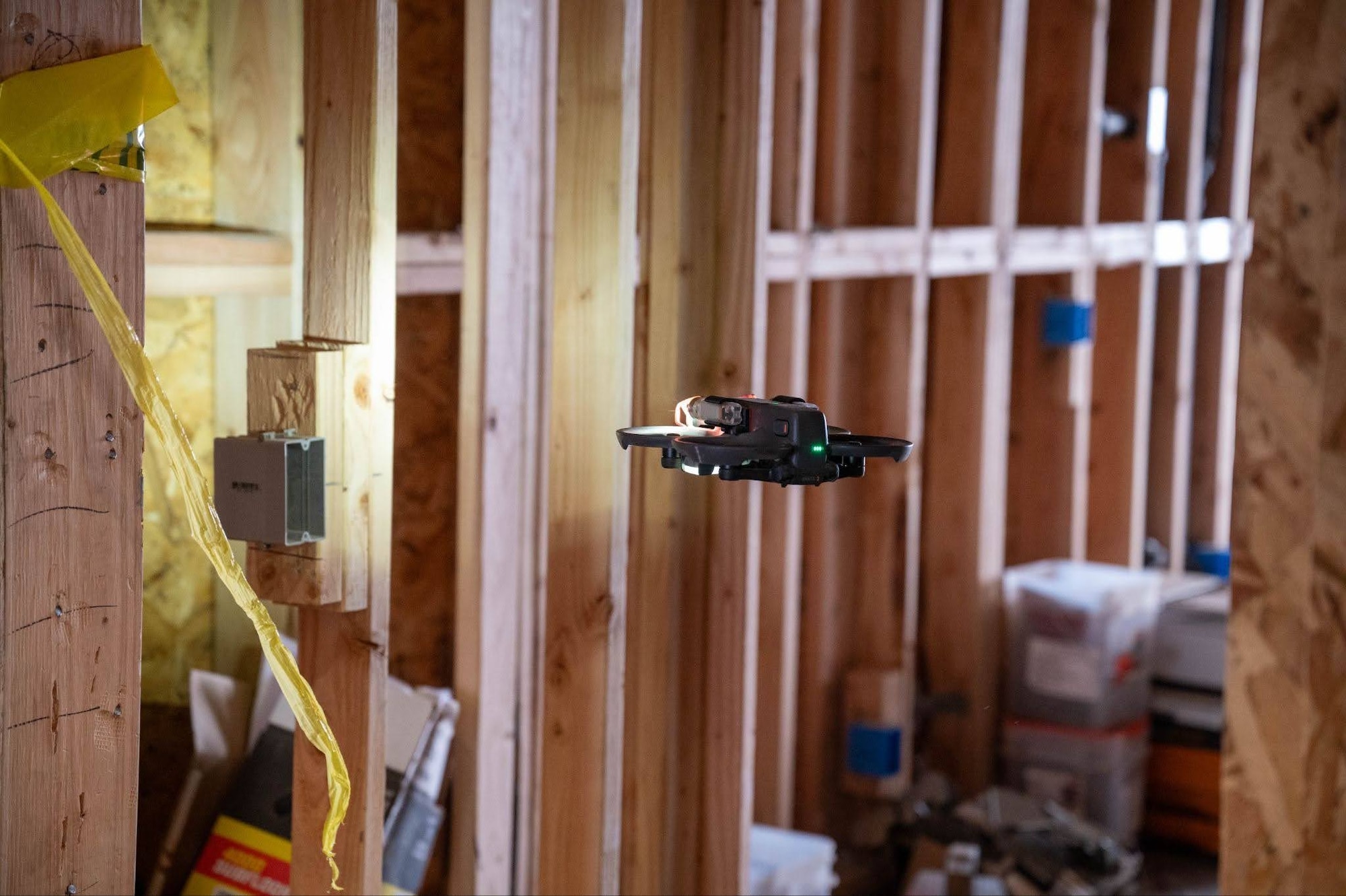 A small quadcopter drone hovers in a construction zone during a search and rescue exercise in Wasilla, Alaska, April 30, 2026. This exercise is a part of a two-day, joint operation with Joint Base Elmendorf-Richardson Explosive Ordnance Disposal where small unmanned aerial systems were used by multiple agencies to explore areas that wouldn’t put people into harm's way. (U.S. Air Force photo by Airman 1st Class Owen Davies)
