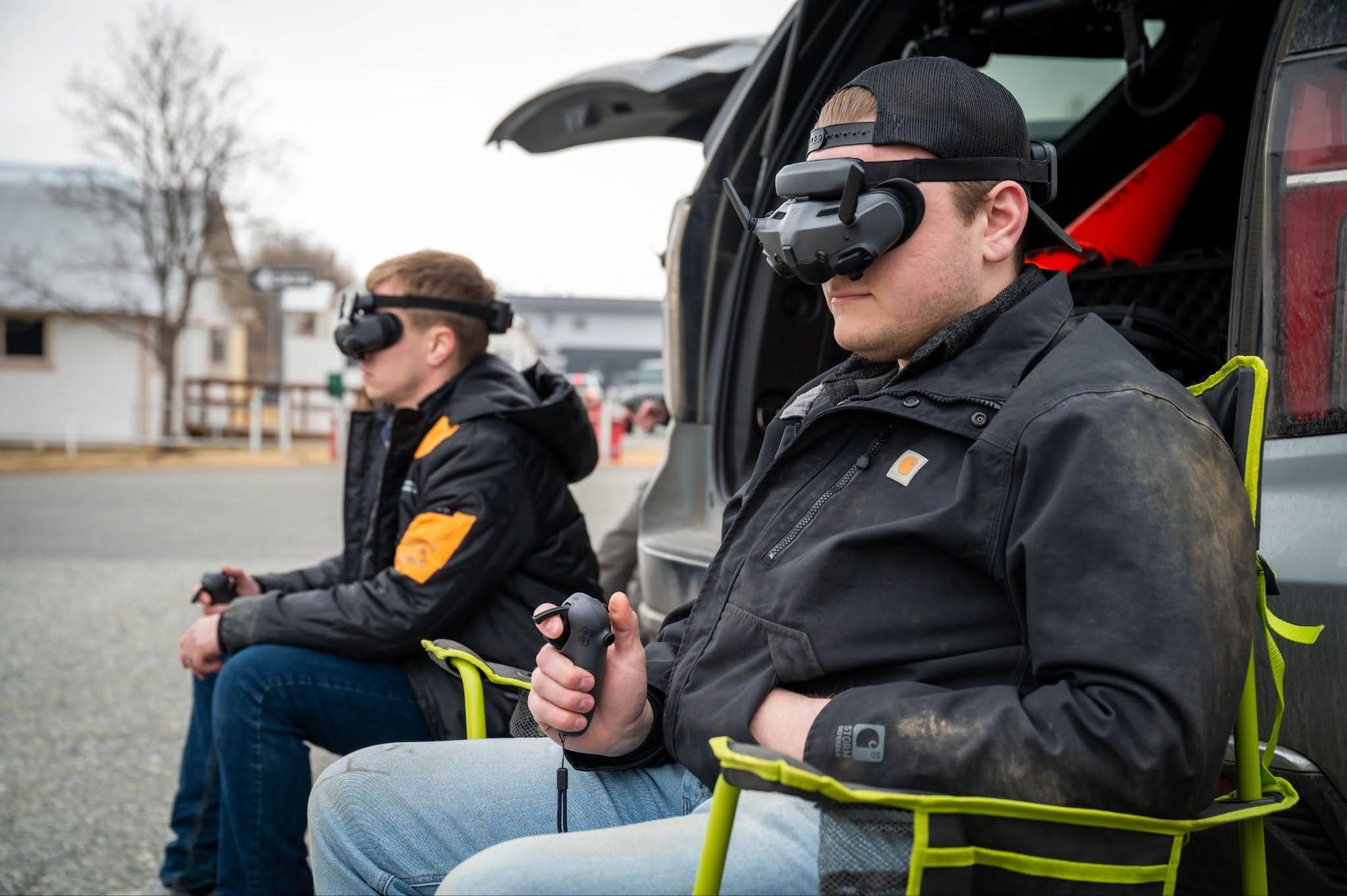 Anchorage Police Department Officers Johnathon Holgate and Alex Bishop control drones during a search and rescue exercise in Wasilla, Alaska, April 30, 2026. During this exercise, operators with Joint Base Elmendorf-Richardson Explosive Ordnance Disposal and other agencies were required to navigate through buildings and perform scanning routes to find unexploded ordnance and human objectives. (U.S. Air Force photo by Airman 1st Class Owen Davies)
