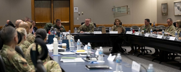 A round table of senior enlisted Airmen discuss topics.