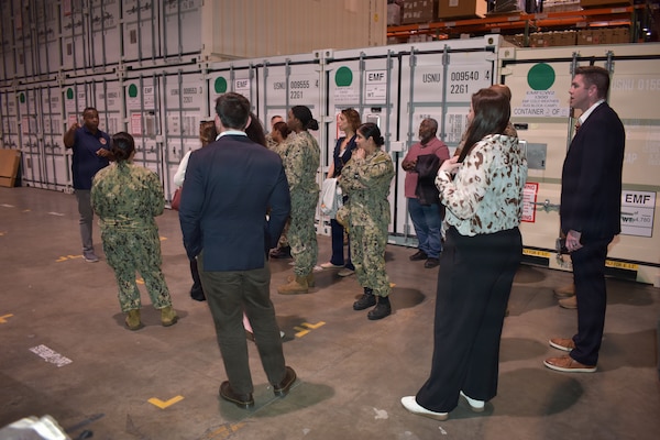 260504-N-VL857-1077 WILLIAMSBURG, Va. (May 5, 2026) - Tony Ward, a medical configuration design manager with Naval Medical Readiness Logistics Command (NMRLC), provides a brief to visitors on the Expeditionary Medical Unit (EMU) Afloat platform during a facility tour on board NMRLC – Cheatham Annex, Williamsburg, Va., May 5, 2026. This equipment set is currently undergoing Test and Evaluation (T&E). The platform consisting of 10 outfitted containers is slated for upcoming transport and evaluation at Joint Expeditionary Base Little Creek-Fort Story. (U.S. Navy photo by Julius Evans)