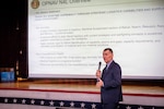 260505-N-KC192-1016 PORTSMOUTH, Va. (May 5, 2026) David Menzen, deputy director of the logistics division of the Office of the Chief of Naval Operations (OPNAV), gives opening remarks during the 2026 Medical Logistics Symposium held on board Naval Medical Center Portsmouth, May 5, 2026. The Navy Medicine Logistics Symposium aims to maintain a common operating picture and update the Medical Logistics community regarding the fiscal year 2026 Navy Medicine Campaign Order and the Navy MEDLOG goal to build a logistics system that delivers ready operational units to support the Naval Strategy. (U.S. Navy photo by Mass Communication Specialist Second Class Levi Decker)