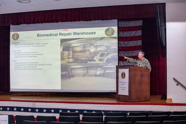 260506-N-KC192-1012 PORTSMOUTH, Va. (May 5, 2026) Capt. Kevin Bailey, commanding officer, Navy Expeditionary Medicine Warfighter Development Center (NEMWDC), briefs on NEMWDC's role in expeditionary medicine during the 2026 Medical Logistics Symposium held on board Naval Medical Center Portsmouth, May 5, 2026. The Navy Medicine Logistics Symposium aims to maintain a common operating picture and update the Medical Logistics community regarding the fiscal year 2026 Navy Medicine Campaign Order and the Navy MEDLOG goal to build a logistics system that delivers ready operational units to support the Naval Strategy. (U.S. Navy photo by Mass Communication Specialist Second Class Levi Decker)