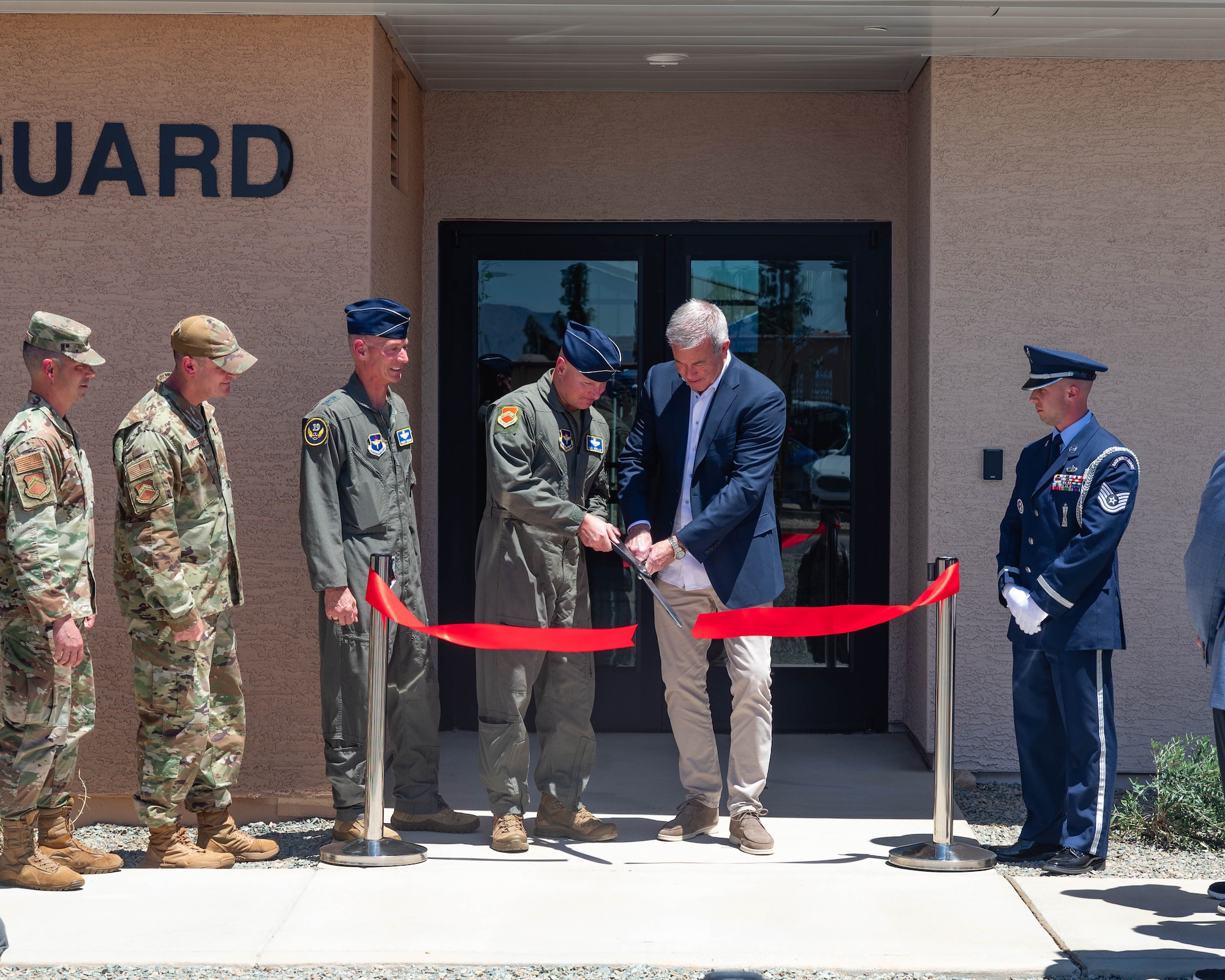 U.S. Air Force Brig. Gen. David Berkland, 56th Fighter Wing commander, and Jeff Gordon, CEO of IDM companies, cut the ribbon for the new Honor Guard facility, May 7, 2026, at Luke Air Force Base, Arizona.