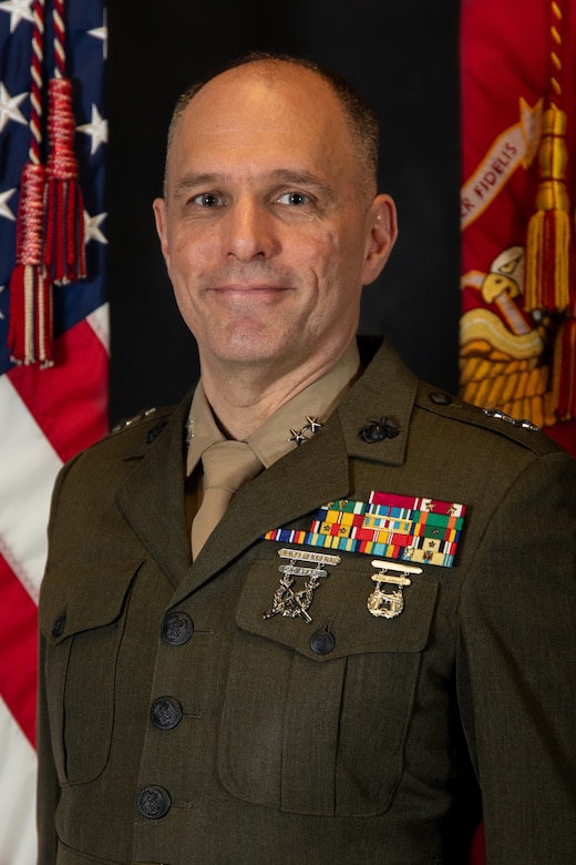 Major General Raymond L. Adams, Commanding General,
4th Marine Division