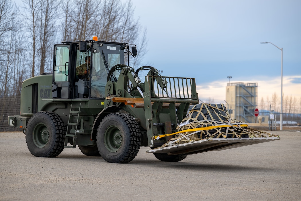 Airman 1st Class Dante Thomas, 354th Logistics Readiness Squadron ground transportation operator, transports cargo with a 10K All-Terrain Forklift.