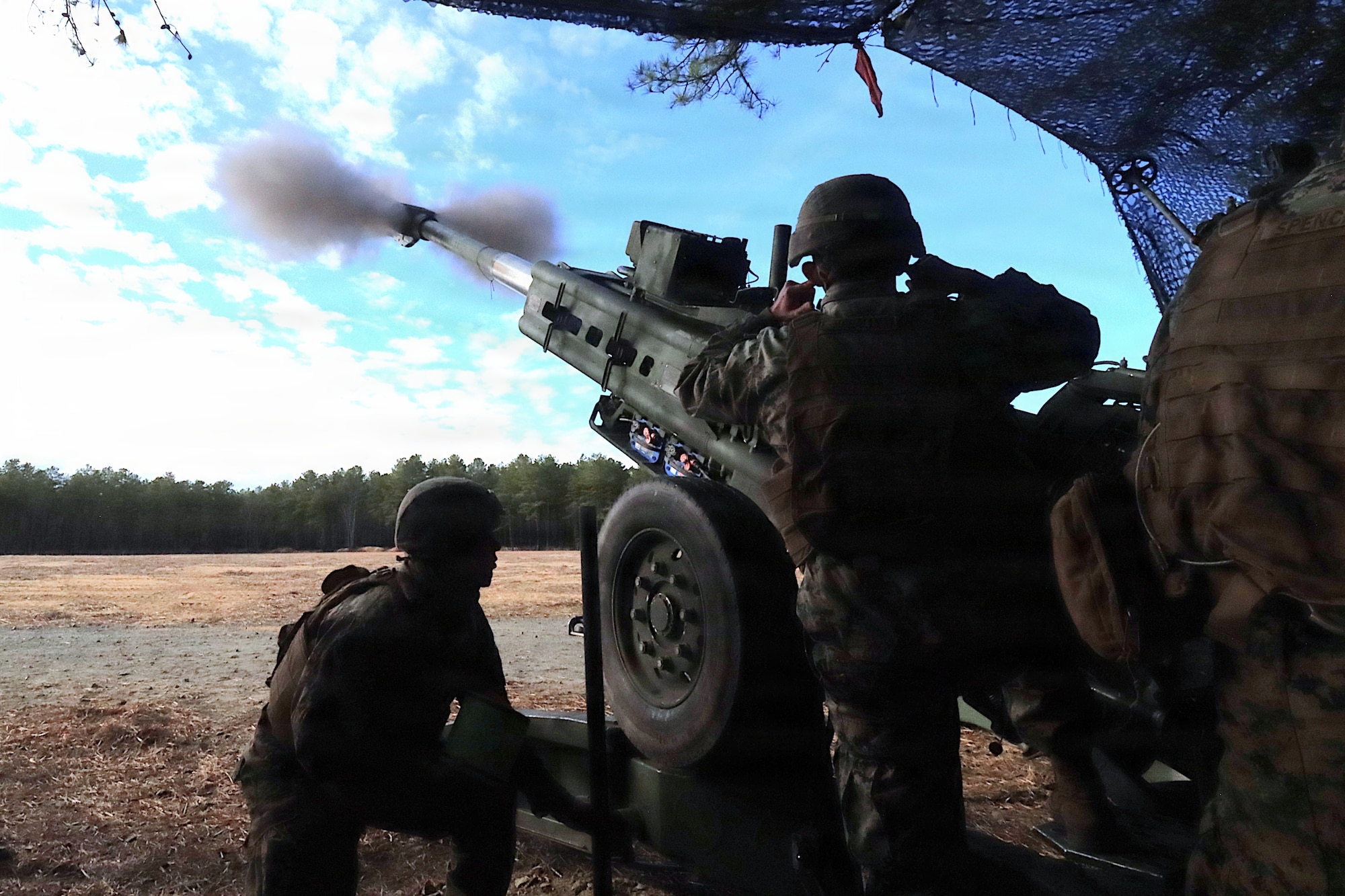 U.S. Marine Corps Reserve Marines assigned to Battery G, 3rd Battalion, 14th Marine Regiment, fire a Howitzer during a combined-arms live-fire exercise at Joint Base McGuire-Dix-Lakehurst, March 21, 2026. The CALFEX, led by 2nd Bn., 25th Marines Regt., included a forward arming and refueling point established by Marine Wing Support Squadron 472, and integrated forces from Marine Forces Reserve units based in New Jersey to conduct aviation and ground operations throughout the exercise. Participating units included Combat Logistics Battalion 25; 125 Headquarters and Support; Marine Aircraft Group 49; Marine Heavy Helicopter Squadron 772; and Marine Light Attack Helicopter Squadron 773. (U.S. Army photo by Steven Roussel)