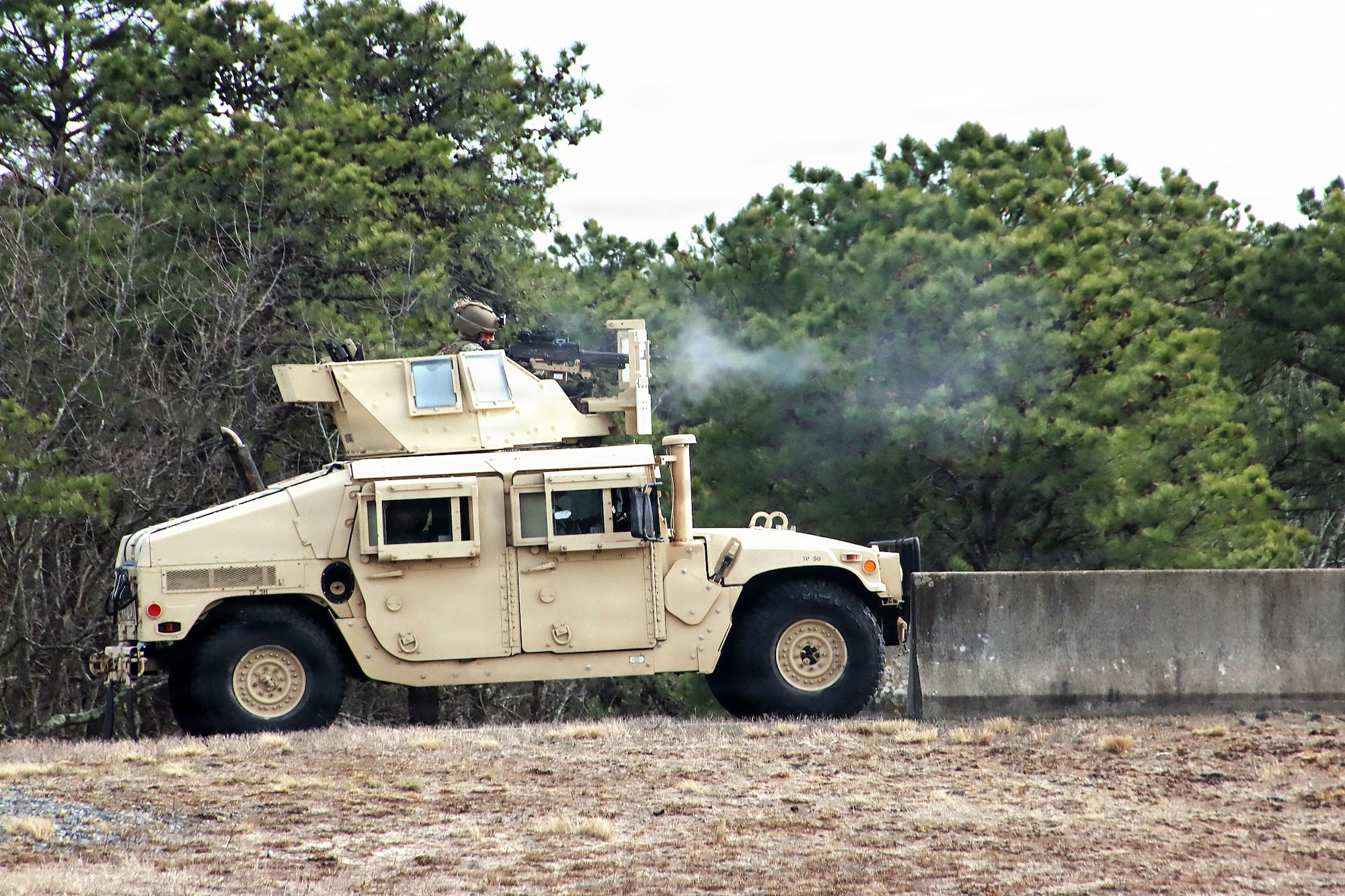 A U.S. Marine Corps Reserve gunnery crew member from the 2nd Battalion, 25th Marines Regiment, fires a .50-caliber machine gun during a combined arms live-fire exercise at Joint Base McGuire-Dix-Lakehurst, N.J., March 21, 2026. The CALFEX, led by 2nd Bn., 25th Marines Regt., included a forward arming and refueling point established by Marine Wing Support Squadron 472, and integrated forces from Marine Forces Reserve units based in New Jersey and operating out of JB MDL to conduct aviation and ground operations throughout the exercise, linking logistics, fires and maneuver elements in a continuous training scenario. (U.S. Army photo by Steven Roussel)