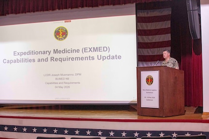 260504-N-KC192-1061 PORTSMOUTH, Va. (May 4, 2026) Lt. Cmdr. Joseph Musmanno, assigned to the Bureau of Medicine and Surgery (BUMED), gives remarks during the 2026 Medical Logistics Symposium held on board Naval Medical Center Portsmouth, May 4, 2026. The Navy Medicine Logistics Symposium aims to maintain a common operating picture and update the Medical Logistics community regarding the fiscal year 2026 Navy Medicine Campaign Order and the Navy MEDLOG goal to build a logistics system that delivers ready operational units to support the Naval Strategy. (U.S. Navy photo by Mass Communication Specialist Second Class Levi Decker)