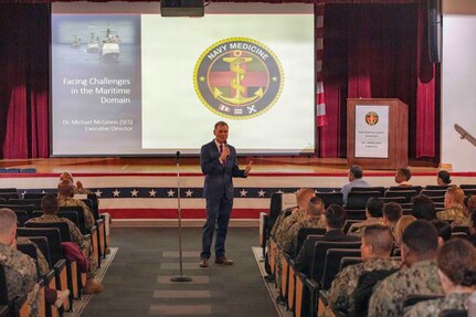 260504-N-KC192-1010 PORTSMOUTH, Va. (May 4, 2026) Dr. Michael McGinnis, Bureau of Medicine and Surgery (BUMED) executive director, gives opening remarks during the 2026 Medical Logistics Symposium held on board Naval Medical Center Portsmouth, May 4, 2026. The Navy Medicine Logistics Symposium aims to maintain a common operating picture and update the Medical Logistics community regarding the fiscal year 2026 Navy Medicine Campaign Order and the Navy MEDLOG goal to build a logistics system that delivers ready operational units to support the Naval Strategy. (U.S. Navy photo by Mass Communication Specialist Second Class Levi Decker)