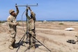 U.S. Army Pfc. Saul Aidaria, left, and Sgt. Jonathan Hillman, both signal support system specialist assigned to 25th Infantry Division Artillery, establishes signal connectivity during Exercise Balikatan 2026 at La Paz Sand Dunes, Laoag City, Philippines, May 1, 2026.