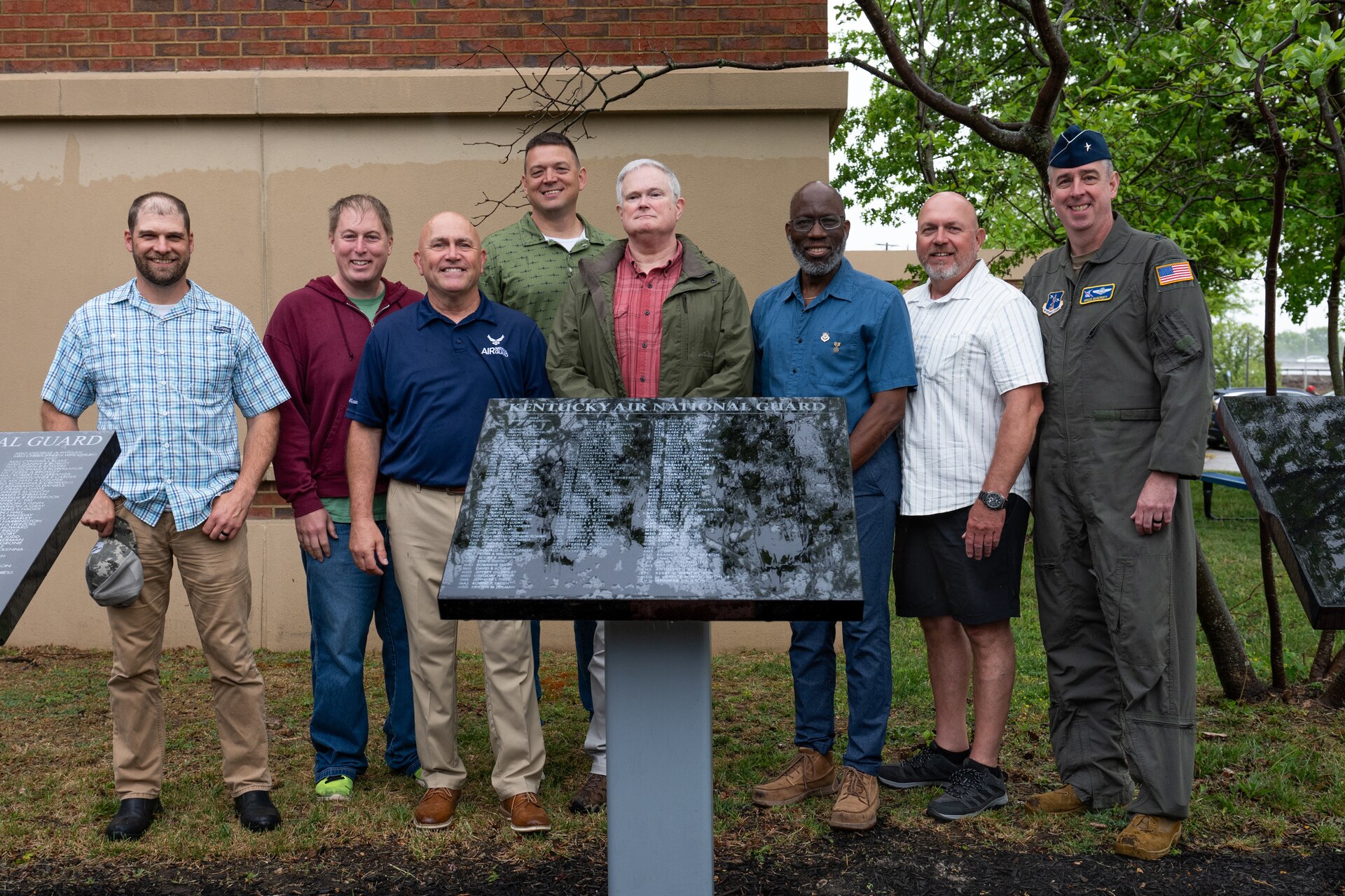 2025 retirees from the Kentucky Air National Guard pose with Brig. Gen. Bruce Bancroft, Kentucky’s adjutant general for Air, during a ceremony at the Kentucky Air National Guard base in Louisville, Ky., April 18, 2026. The names of 53 new retirees were unveiled on a granite plaque during the event, which was held in front of the 123rd Airlift Wing’s Lt. Gen. John B. Conaway Headquarters Building. (U.S. Air National Guard photo by Airman 1st Class Angelee Barnett)