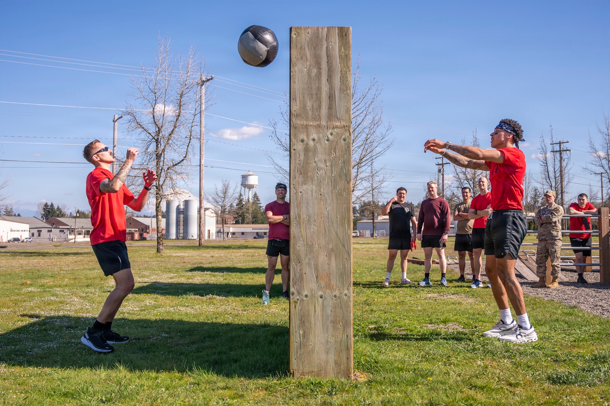 U.S. Air Force Senior Airman Matthew Ramos, 7th Airlift Squadron loadmaster, left, and Senior Airman Thaddeus Lindsey, 627th Force Support Squadron food service shift leader, compete in a “Medicine Ball Toss” during the Julius A. Kolb Airman Leadership School Commandant’s Crucible at Joint Base Lewis-McChord, Washington, April 7, 2026.