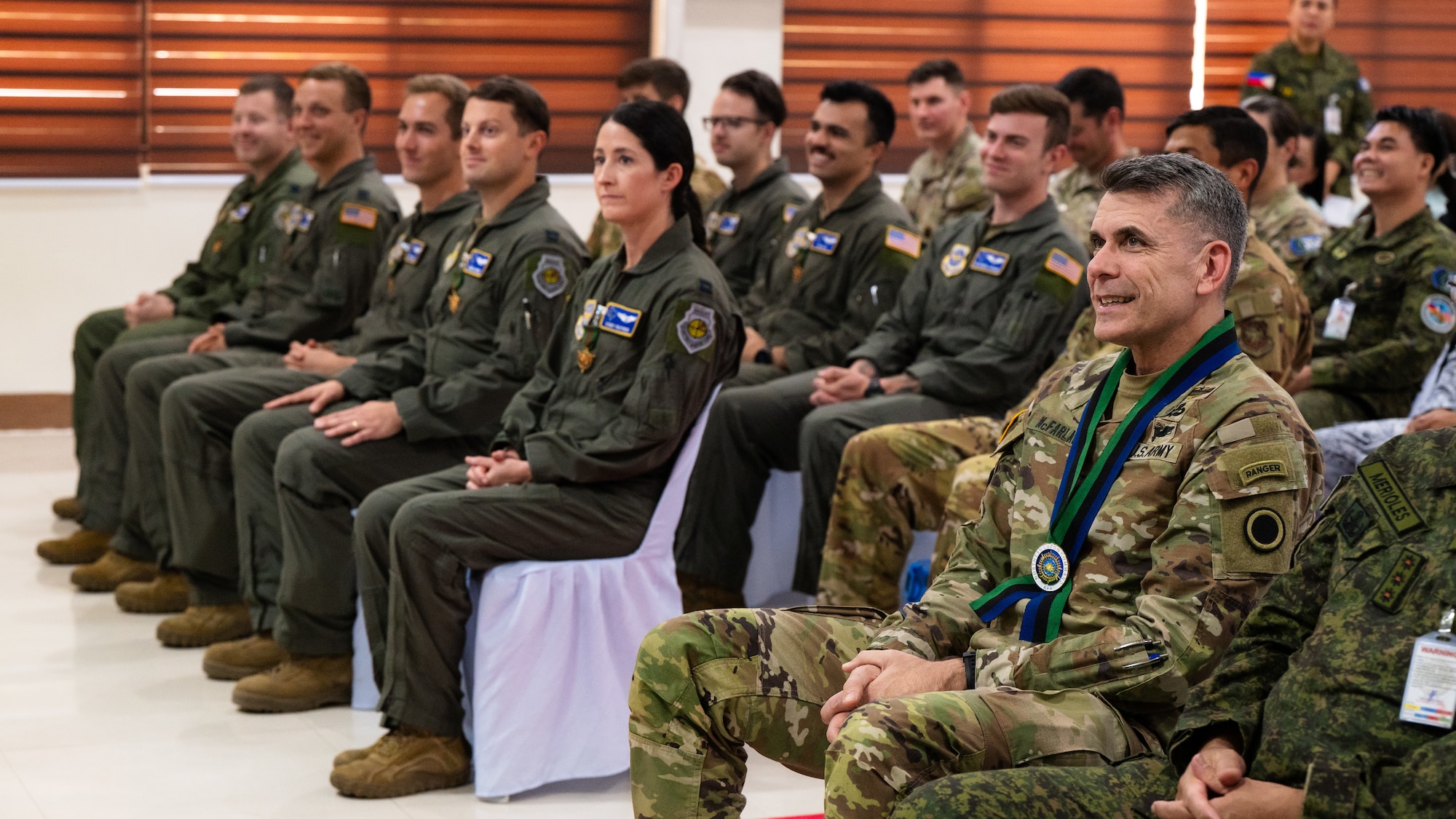 U.S. Army Lt. Gen. Matthew McFarlane, right, commanding general of I Corps, and U.S. Airmen assigned to the 40th Airlift Squadron attend an awards ceremony during Exercise Balikatan 2026 at Camp General Servillano A. Aquino, Philippines, May 5, 2026. Balikatan is a longstanding annual exercise between the Armed Forces of the Philippines and U.S. military that represents the strength of our alliance, improves our capable combined force, and demonstrates our commitment to regional peace and prosperity. (U.S. Air Force photo by Senior Airman Jade M. Caldwell)