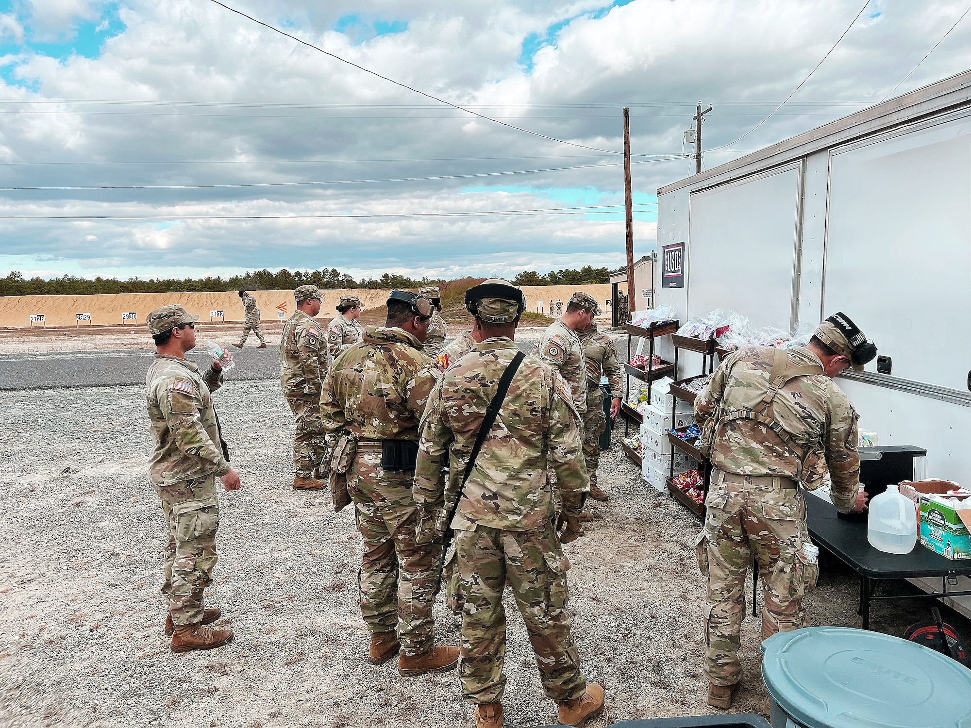 U.S. Army Soldiers get refreshments at a USO mobile canteen during a break from training at Joint Base McGuire-Dix-Lakehurst, N.J., April 18, 2026. Using this recreational vehicle, USO New Jersey staff members and volunteers create a field-based support area to provide coffee and refreshments, and other amenities to service members at the ranges so they don’t have to interrupt training. (Courtesy photo)