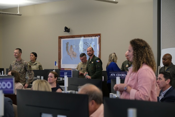 photo of USAF, French Air Force member, civic leaders in a AOC
