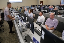photo of USAF civilian speaks to civic leaders