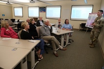 photo of USAF Airman briefing civilians