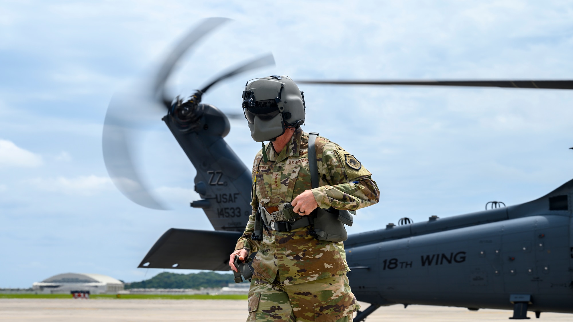 U.S. Air Force Gen. Kevin Schneider, Pacific Air Forces commander, steps off an HH-60W Jolly Green II assigned to the 33rd Rescue Squadron at Kadena Air Base, Japan, April 29, 2026. The flight enabled Schneider to observe the squadron’s readiness to execute personnel recovery operations in complex and contested environments. (U.S. Air Force photo by Airman 1st Class Francisco Huerta)