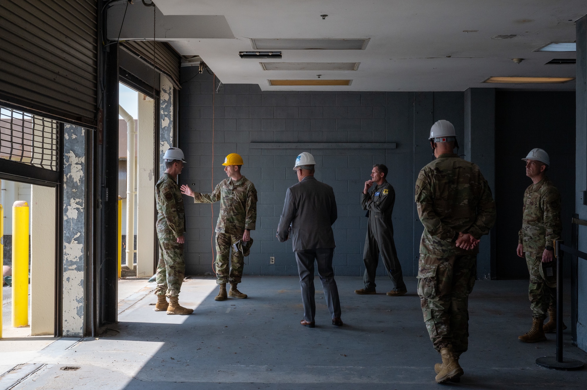 U.S. Air Force Gen. Kevin Schneider, left, Pacific Air Forces commander, and Brig. Gen. John Gallemore, right, 18th Wing commander, visit the 733rd Air Mobility Squadron during an immersion tour at Kadena Air Base, Japan, April 29, 2026. The engagement highlighted air mobility capabilities that enable force projection and sustain operations across the Indo-Pacific. (U.S. Air Force photo by Airman 1st Class Karina Lopez)