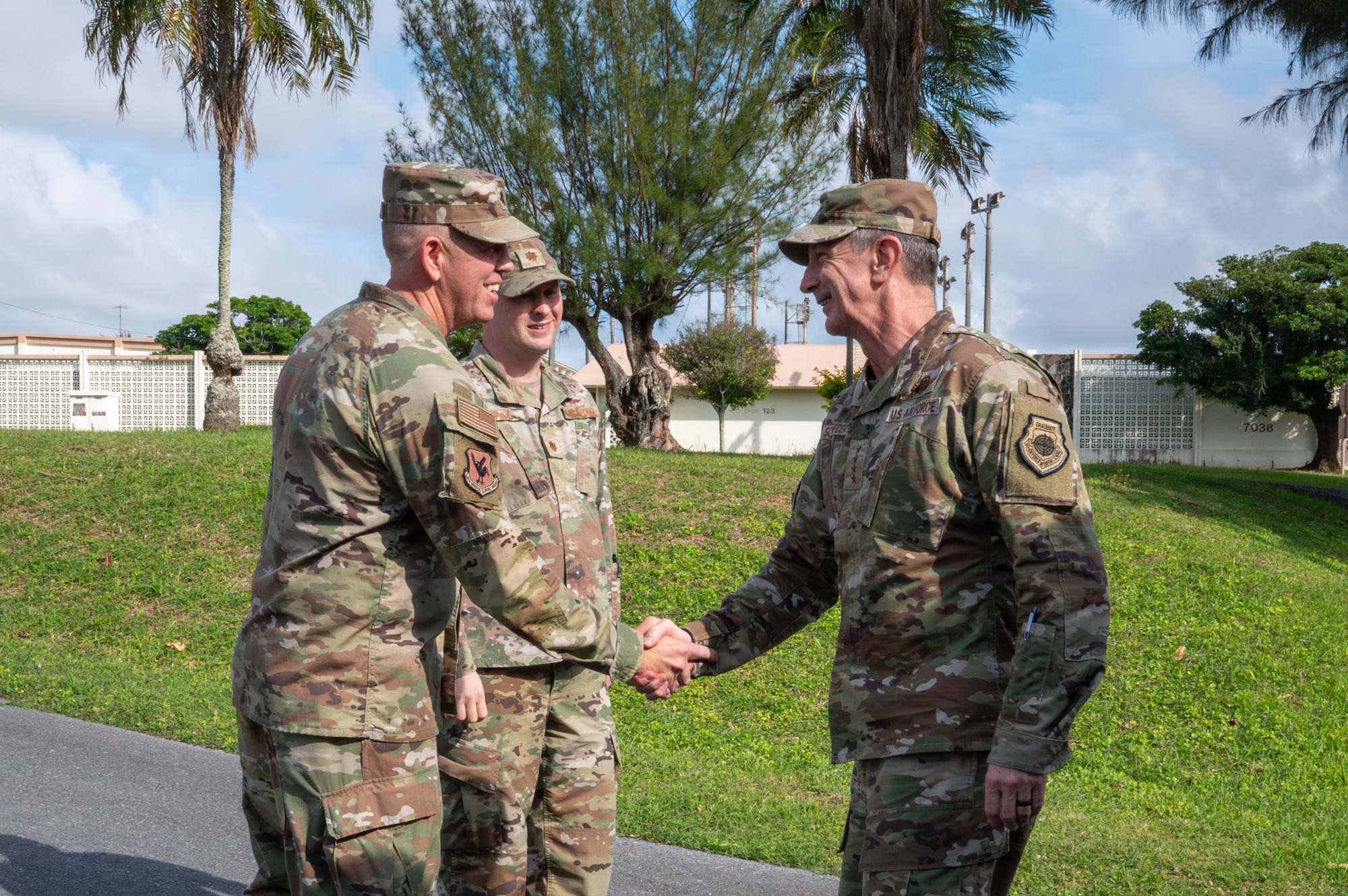 U.S. Air Force Gen. Kevin Schneider, right, Pacific Air Forces commander, is greeted by Lt. Col. Gregg Chilson, 18th Mission Support Group deputy commander, during an immersion tour at Kadena Air Base, Japan, April 29, 2026. The visit highlighted installation support functions that enable mission readiness and operational effectiveness. (U.S. Air Force photo by Airman 1st Class Karina Lopez)