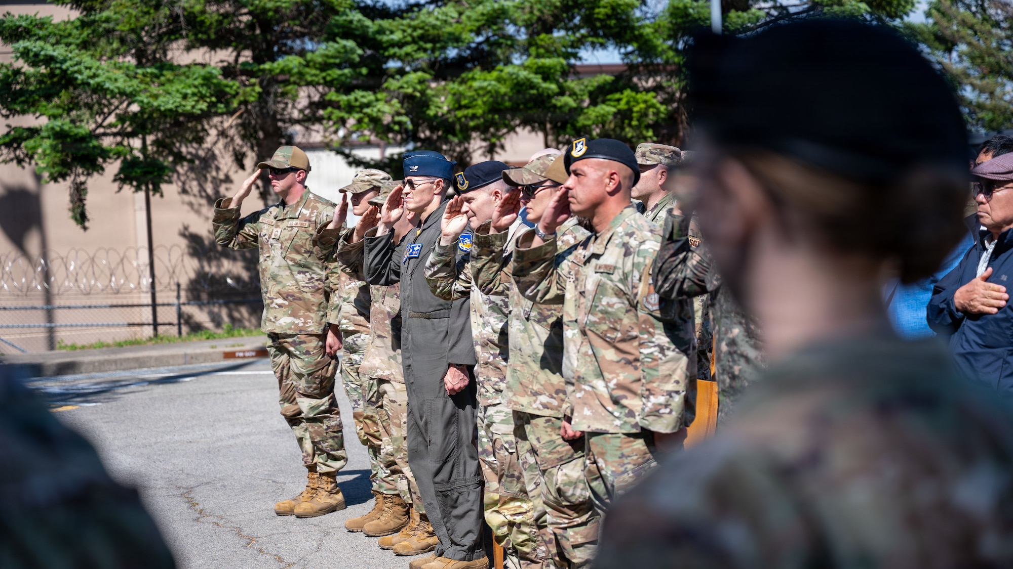 U.S. Airmen assigned to the 51st Fighter Wing salute during TAPs, signaling the end of Police Week at Osan Air Base, Republic of Korea, May 8, 2026. The memorial bell was rung following the reading of each fallen Defender’s name, honoring their sacrifice and ensuring their legacy is remembered by the Defender community. (U.S. Air Force photo by Senior Airman Rome Bowermaster)