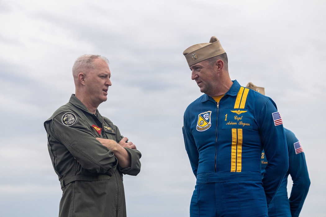 U.S. Marine Corps Maj. Gen. Ryan S. Rideout, commanding general, 2nd Marine Aircraft Wing, speaks with U.S. Navy Capt. Adam Bryan, Blue Angels flight leader and F/A-18 Super Hornet pilot, ahead of the 2026 air show at Marine Corps Air Station Cherry Point, North Carolina, May 7, 2026. Headlined by the Blue Angels, the air show is a community outreach event, hosted biennially, as an expression of appreciation to neighboring communities and partners for their continued support in mission success. (U.S. Marine Corps photo by Sgt. David Ornelas Baeza)