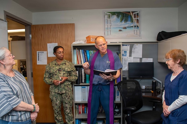 PORTSMOUTH, Va. (May 6, 2026) Lt. Cmdr. Lloyd Wicker assisted by Religious Program Specialist 3rd Class Helen McElroy, both assigned to Naval Medical Center Portsmouth (NMCP), provide pastoral services during nurse's week, May 6, 2026. Navy Medicine Readiness and Training Command (NMRTC) Portsmouth is the premier readiness and training platform that provides superior medical training for military medical service members at NMCP, the U.S. military’s oldest, continuously operating military hospital since 1830. (U.S. Navy photo by Mass Communication Specialist 2nd Class Thomas Boatright)