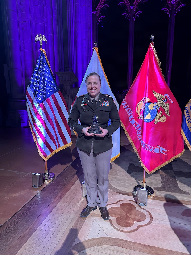 Maj. Erika B. Page, an emergency medicine physician assigned to the 158th Maneuver Enhancement Brigade, Arizona Army National Guard, presents her award as the U.S. Army Honoree of the 2026 Hero of Military Medicine Award, sponsored by the Henry M. Jackson Foundation, during the awards ceremony on May 7, 2026, at the National Cathedral in Washington D.C.