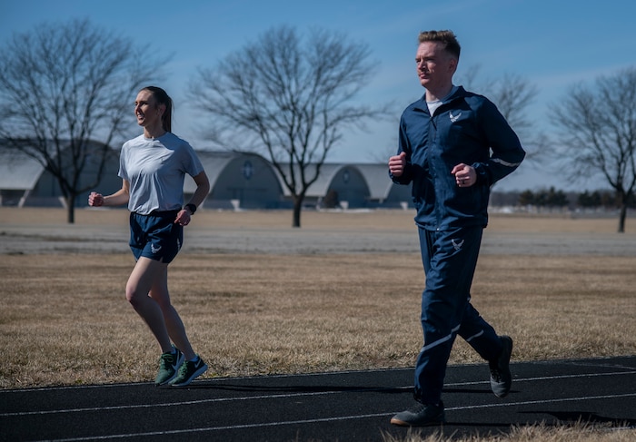 Two people running