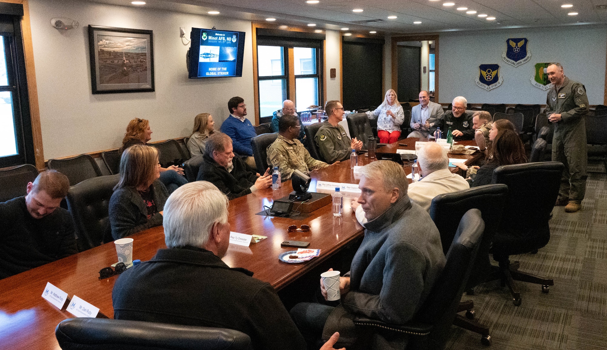 U.S Air Force Col. Jesse Lamarand gives a brief to distinguished visitors during a base tour.