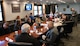U.S Air Force Col. Jesse Lamarand gives a brief to distinguished visitors during a base tour.