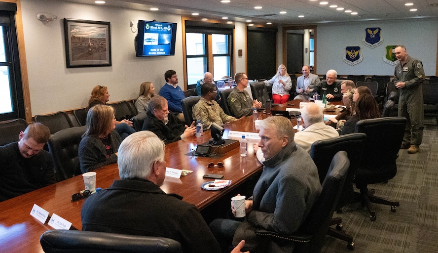 U.S Air Force Col. Jesse Lamarand gives a brief to distinguished visitors during a base tour.