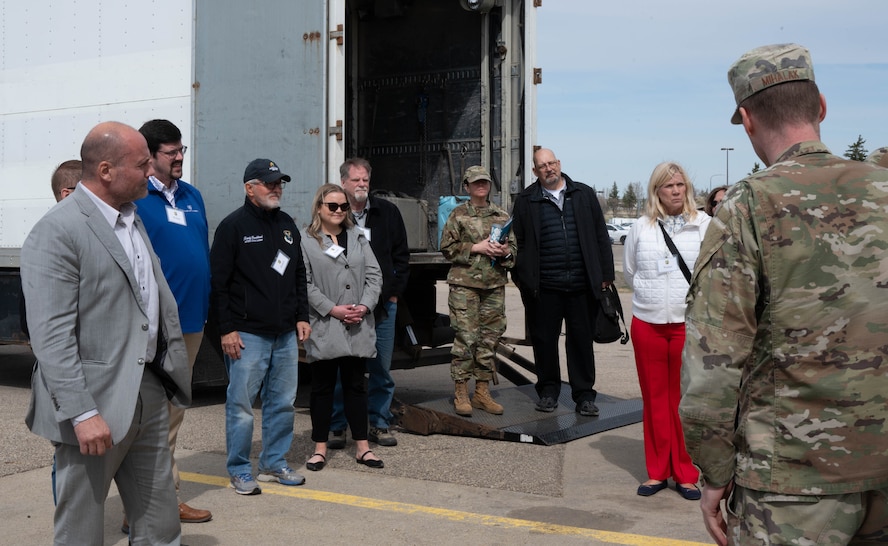 Distinguished visitors tour a training missile launch facility.