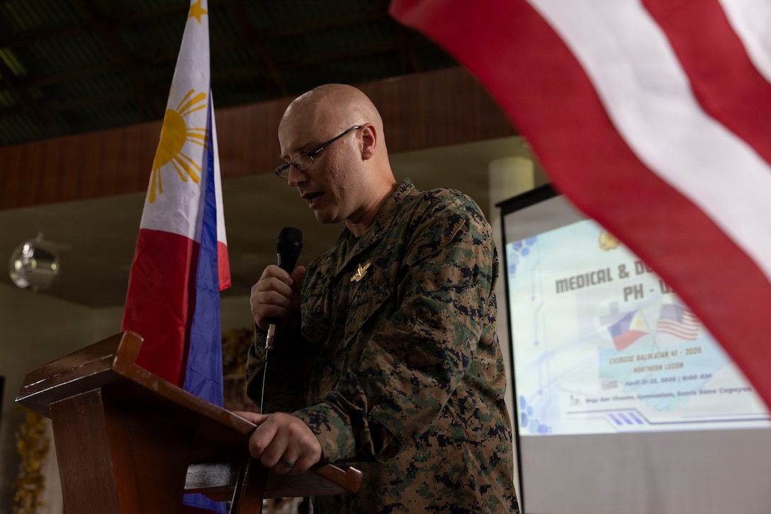 U.S. Navy Lt. Kevin Gilchrist, a chaplain assigned to 9th Communication Battalion, I Marine Expeditionary Force Information Group, I Marine Expeditionary Force, leads a prayer during a cooperative health engagement as part of Exercise Balikatan 2026 in San Vicente, Philippines, April 21, 2026. Balikatan is a longstanding annual exercise between the Armed Forces of the Philippines and U.S. military that represents the strength of our alliance, improves our capable combined force, and demonstrates our commitment to regional peace and prosperity. (U.S. Marine Corps photo by Lance Cpl. Mia Ocampo)