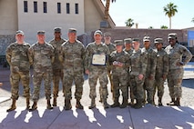 Group photo of U.S. Airmen holding a certificate.