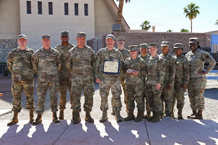 Group photo of U.S. Airmen holding a certificate.