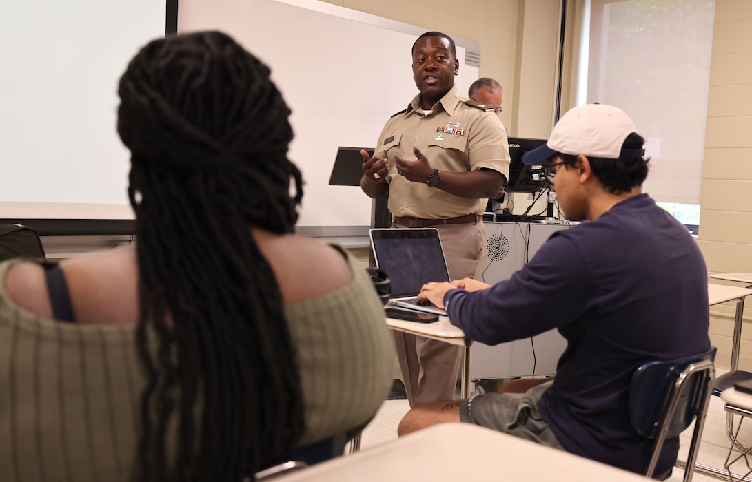 Picture of a COL talking to students.