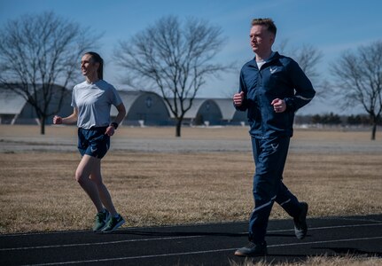 Two people running