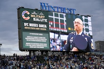 Sgt. 1st Class Moises Garcia, 85th U.S. Army Reserve Support Command, appears on the Wrigley Field jumbotron during a military salute at the Chicago Cubs home game, May 5, 2026, at Wrigley Field. Garcia was honored for his 31 years of service, including five overseas deployments.