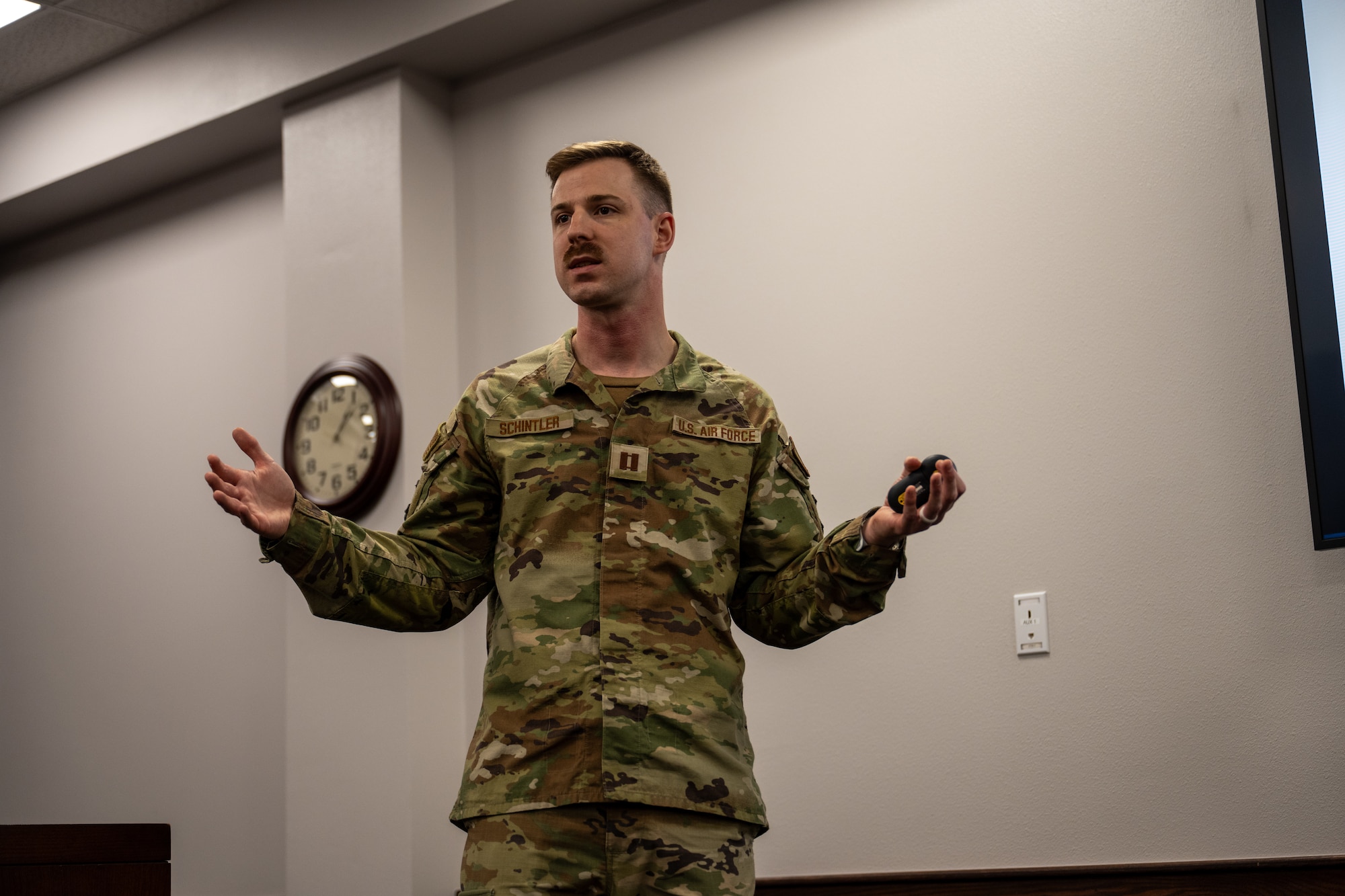 U.S. Air Force Capt. Heath Schintler, 97th Air Mobility Wing civil law chief, briefs fourth-grade students on the Uniform Code of Military Justice at Altus Air Force Base, Oklahoma, May 1, 2026. The briefing was part of a Law Day event hosted by the 97th AMW Judge Advocate office to teach students about the legal system, military justice and civic responsibility. (U.S. Air Force photo by Airman 1st Class Nathan Langston)