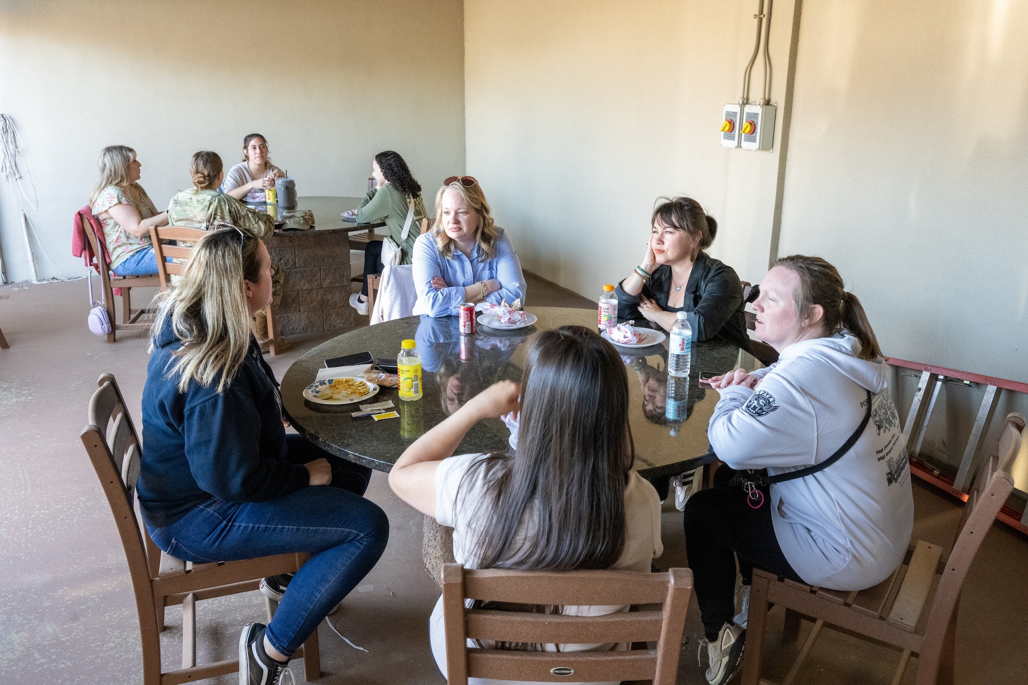 Military spouses enjoy a catered lunch at the Delaware United Service Organization on Dover Air Force Base, Delaware, May 5, 2026. A total of 35 military spouses from units across Dover AFB attended a tour in observance of Military Spouse Appreciation Day. (U.S. Air Force photo by Mauricio Campino)