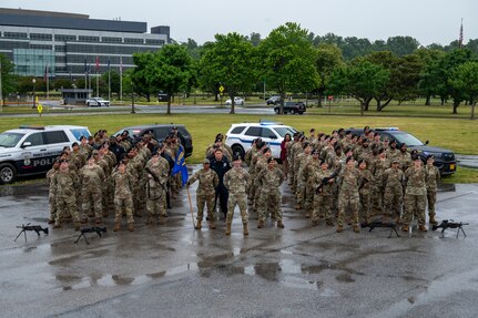 The 11th Security Forces Squadron gathers for a photo on Joint Base Anacostia-Bolling, Washington, D.C., May 11, 2026. Throughout their mission, JBAB defenders have delivered air base ground defense and law enforcement to the 11th Wing, 74 mission partners, and the JBAB community to safeguard the installation. (U.S. Air Force photo by Hayden Hallman)