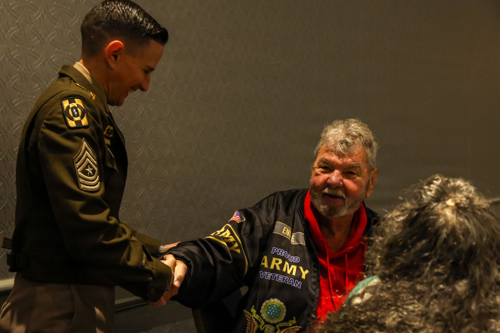 U.S. Army Sgt. Maj. Lauren Flores, Defense POW/MIA Accounting Agency senior enlisted advisor, speaks to Robert Engel, cousin of Sgt. Earl Victor Siegmund during the DPAA Family Member Update in Detroit, Mi., May 2, 2026.