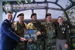 U.S. Air Force Col. Derek Rankin, chief of staff for the Defense POW/MIA Accounting Agency and U.S. Army Sgt. Maj. Lauren Flores, the DPAA senior enlisted advisor pose for a photo with Vietnam Veterans of America Chapter 154 during a Family Member Update in Detroit, Mi., May 2, 2026.