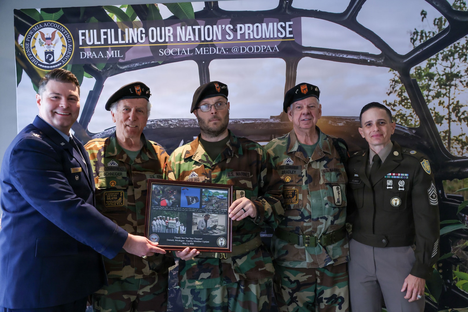 U.S. Air Force Col. Derek Rankin, chief of staff for the Defense POW/MIA Accounting Agency and U.S. Army Sgt. Maj. Lauren Flores, the DPAA senior enlisted advisor pose for a photo with Vietnam Veterans of America Chapter 154 during a Family Member Update in Detroit, Mi., May 2, 2026.
